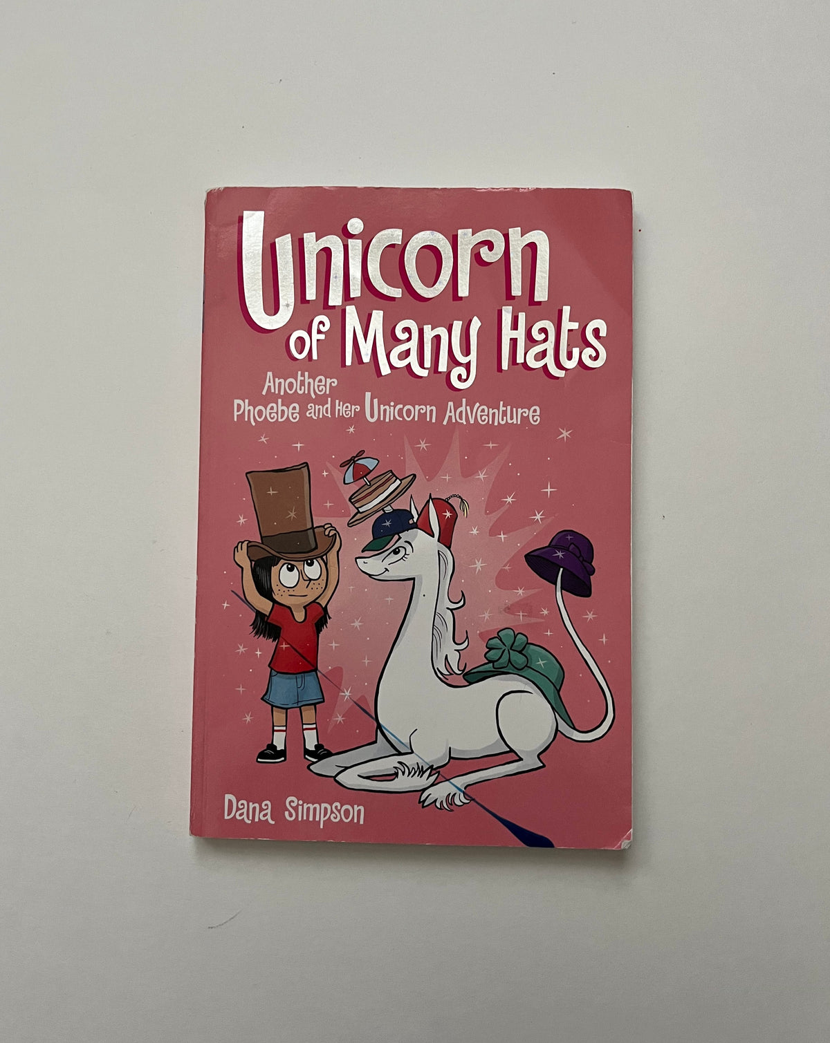 Unicorn of Many Hats: Another Phoebe and her Unicorn Adventure by Dana Simpson