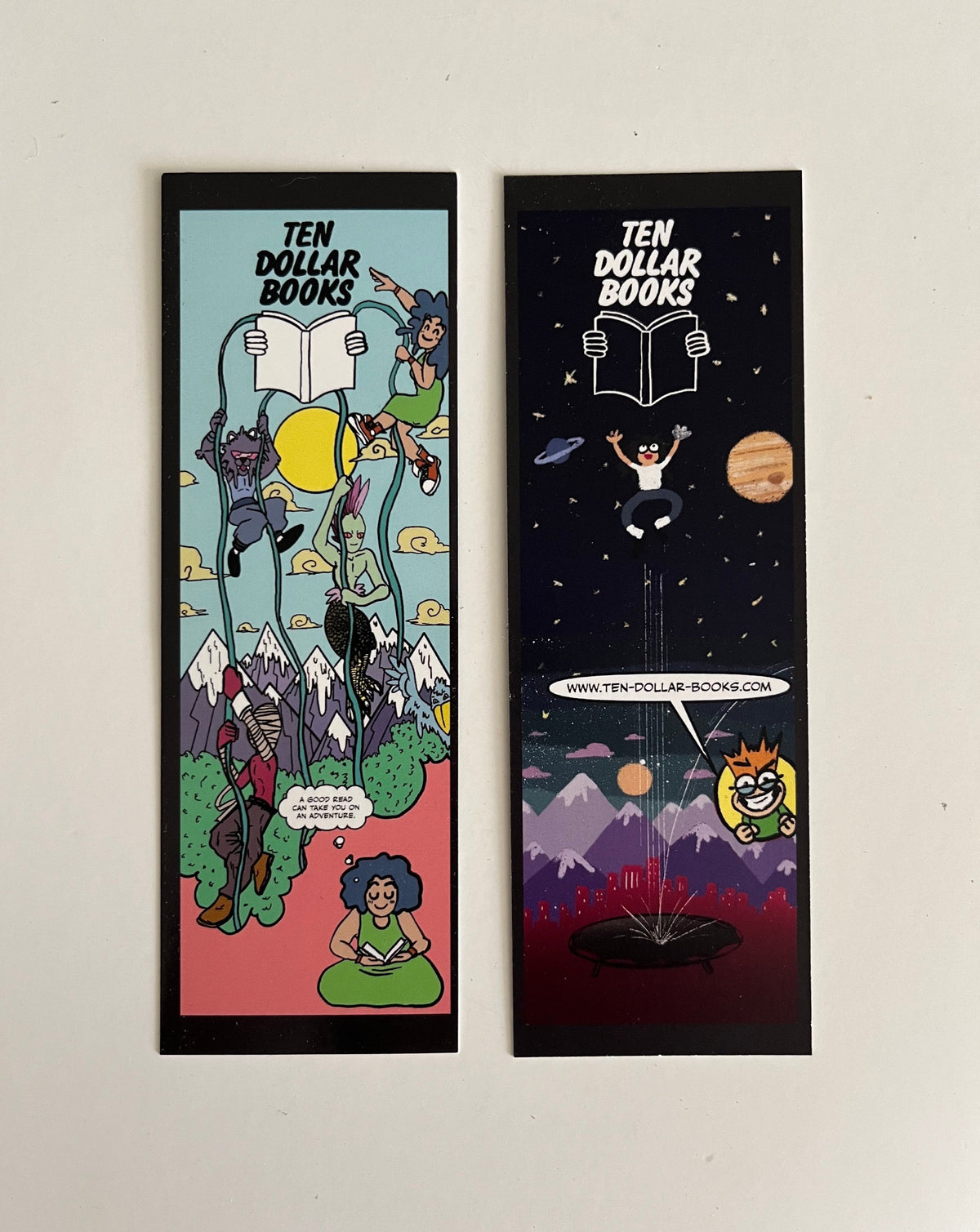 Bookmarks with art by Lyle Omolayo